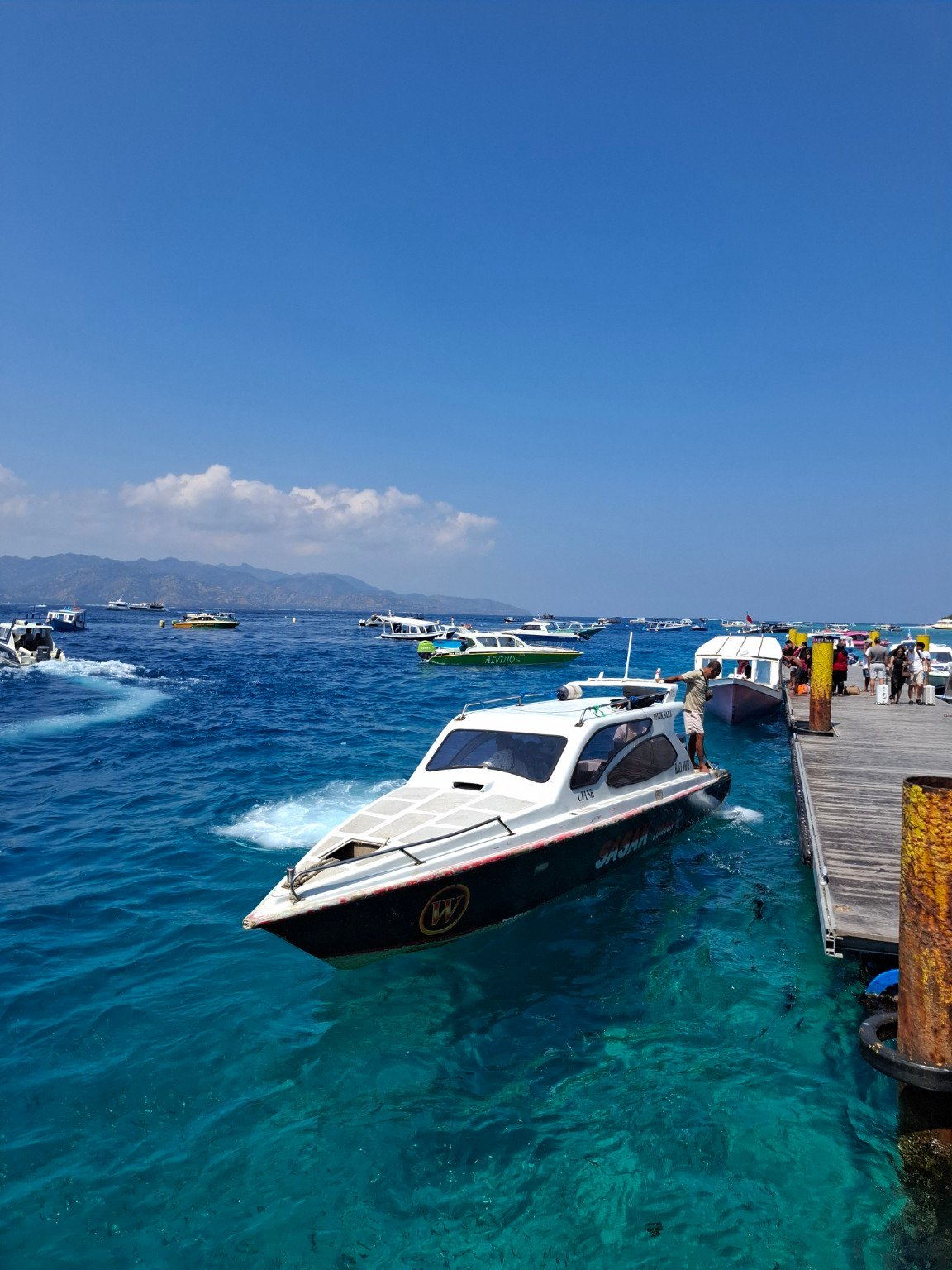 Fastboat crossing open water between the islands