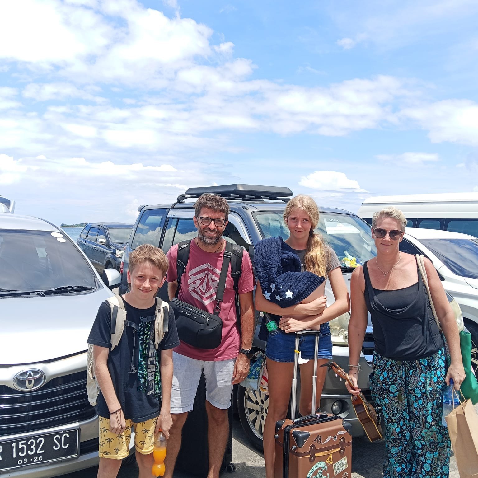 Family group with their driver before departure