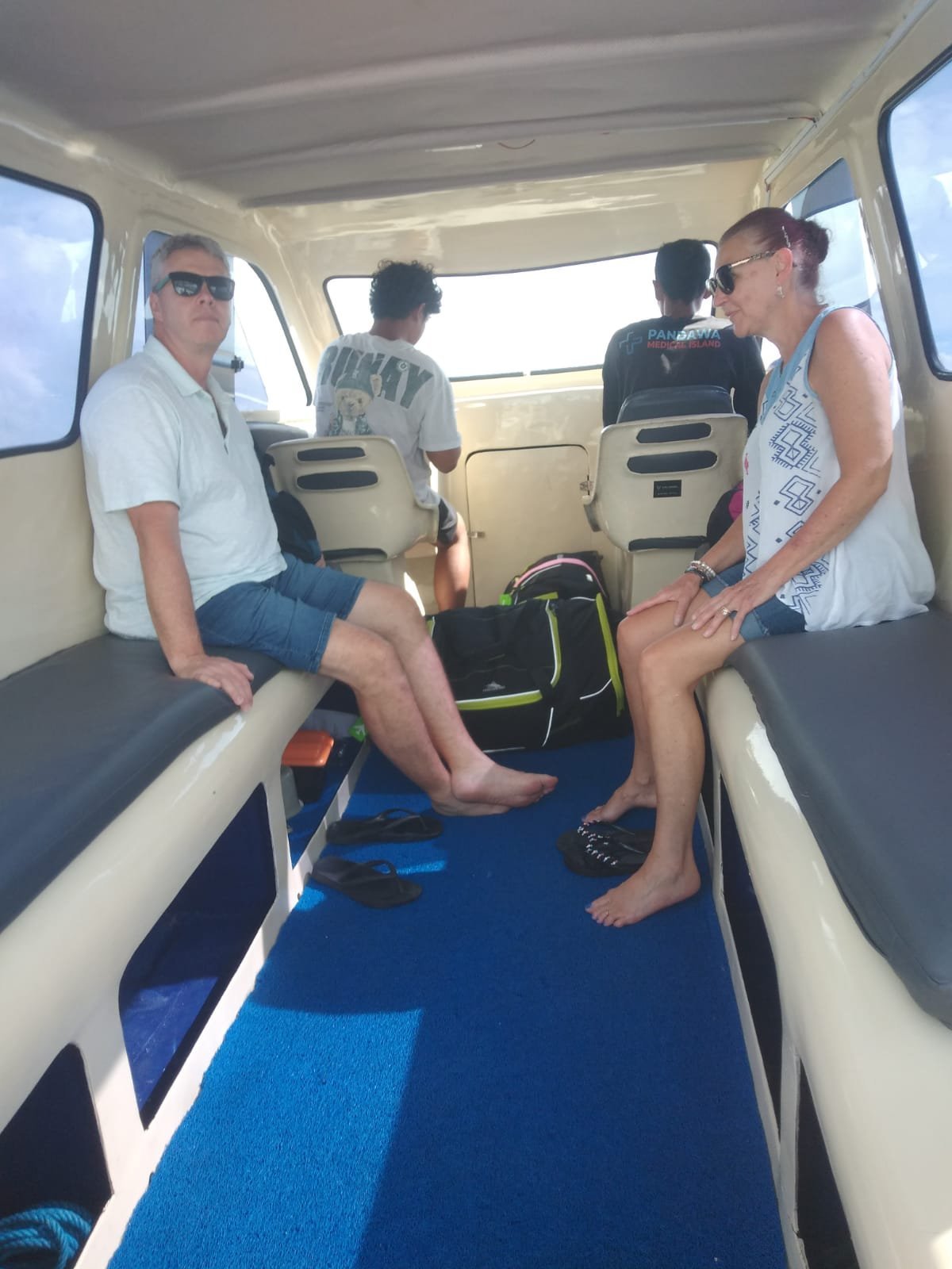 Guests and luggage inside the private speed boat cabin
