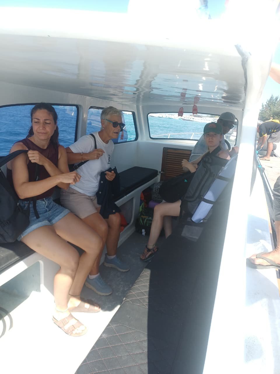 Guests seated inside a private speed boat